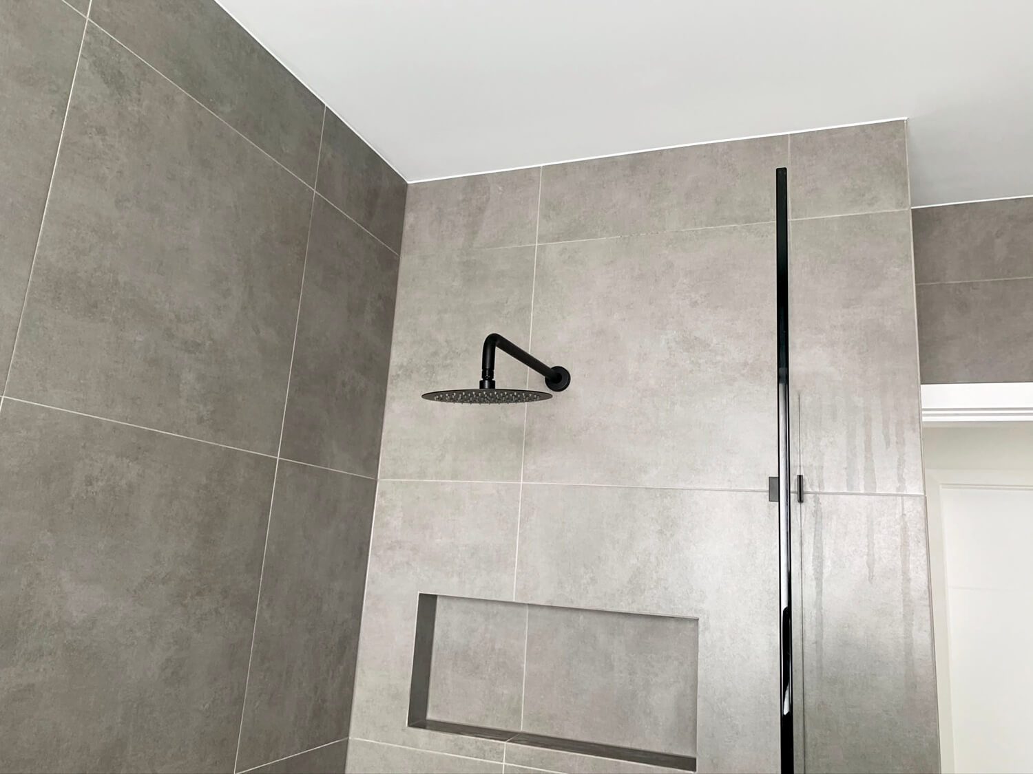 Silicone sealing around a shower in a Sydney bathroom